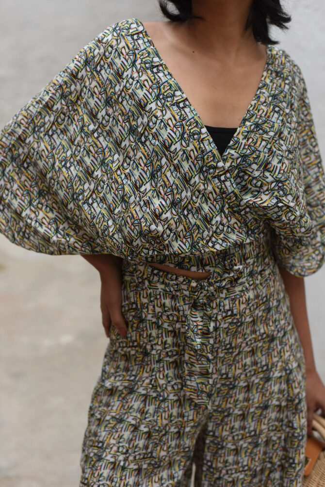 V-neck tie top with box pleat pants